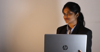Student presenting with a laptop