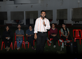 Students gathered together while one student addressing other students