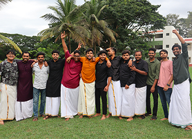 A student dressed in south indian attire enjoying the KIM event