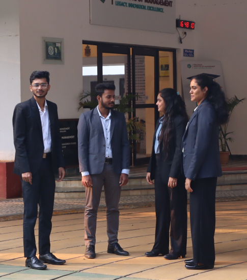 Management students at KIM dressed professionally, gossiping with each other