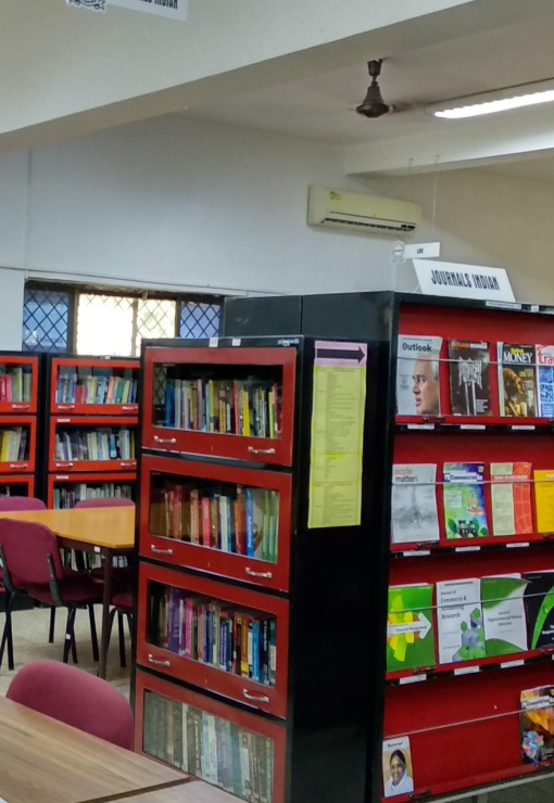 Library with bookshelves and study tables at Kirloskar Institute of Management, Harihar