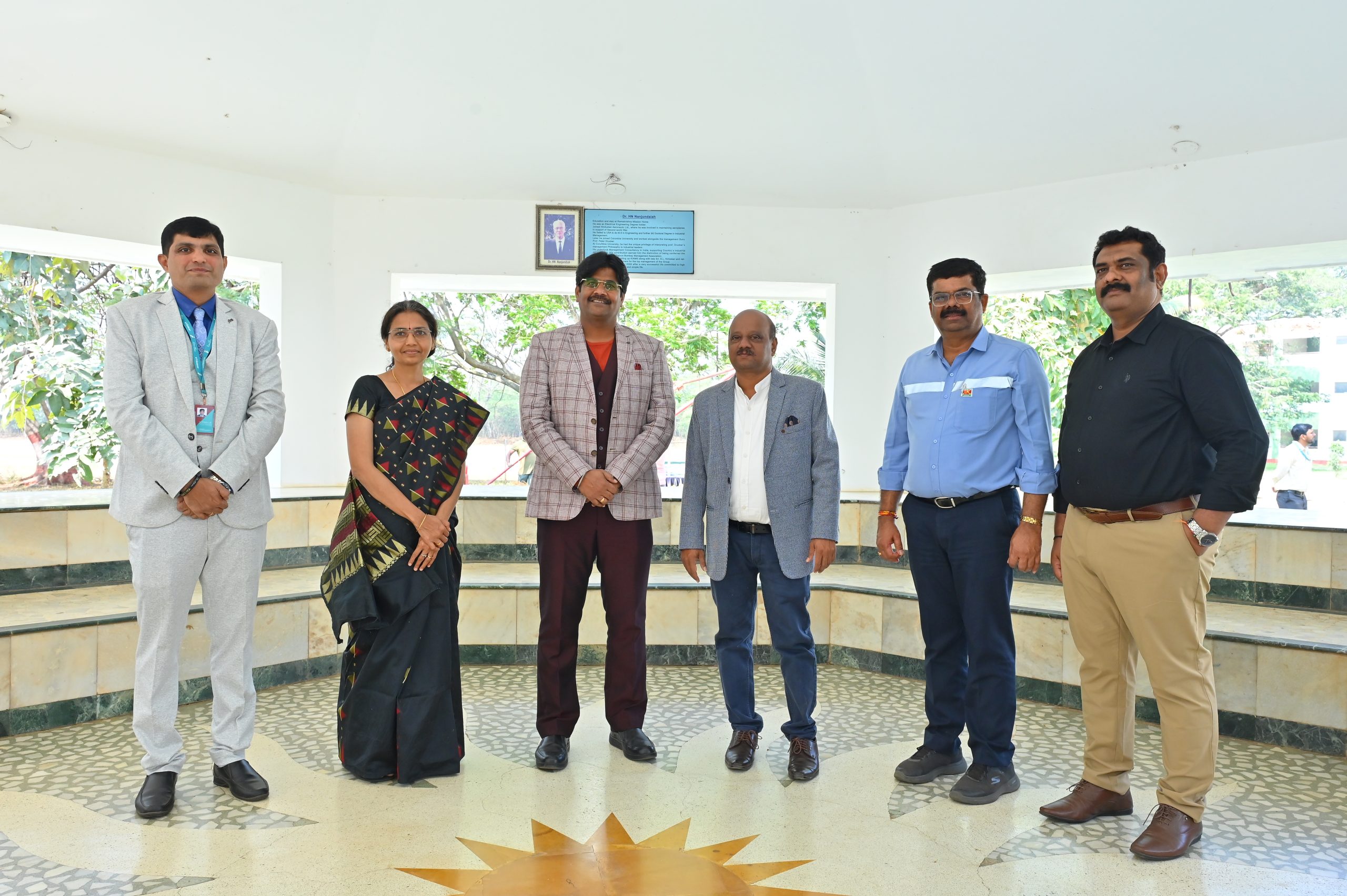 Faculty Members standing together at KIM Harihar Campus