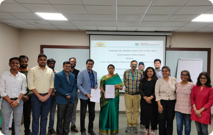 Faculty and students posing together during an academic recognition COEP Bhau Institute Collaboration