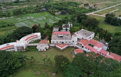 Drone shot of the Kim Harihar Campus surrounded with greenery